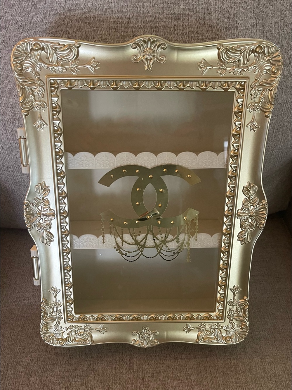 Gorgeous golden cc display cabinet.